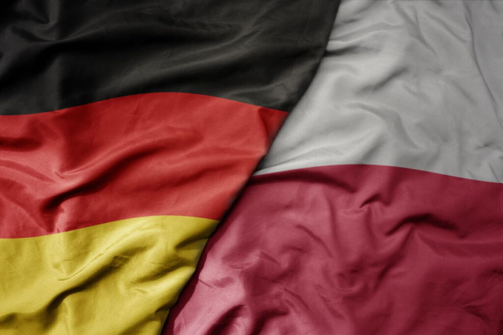 Flagi Niemiec i Polski symbolizują tłumaczenia z niemieckiego na polski.