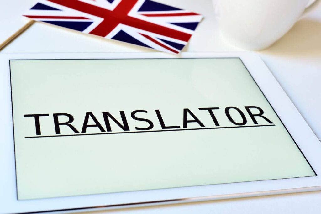 Tablet z napisem "Translator", sugerujący tłumaczenie dokumentów.